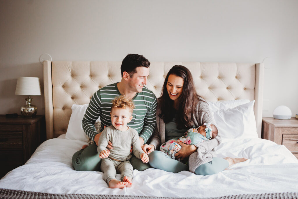 bed newborn family lifestyle photo
